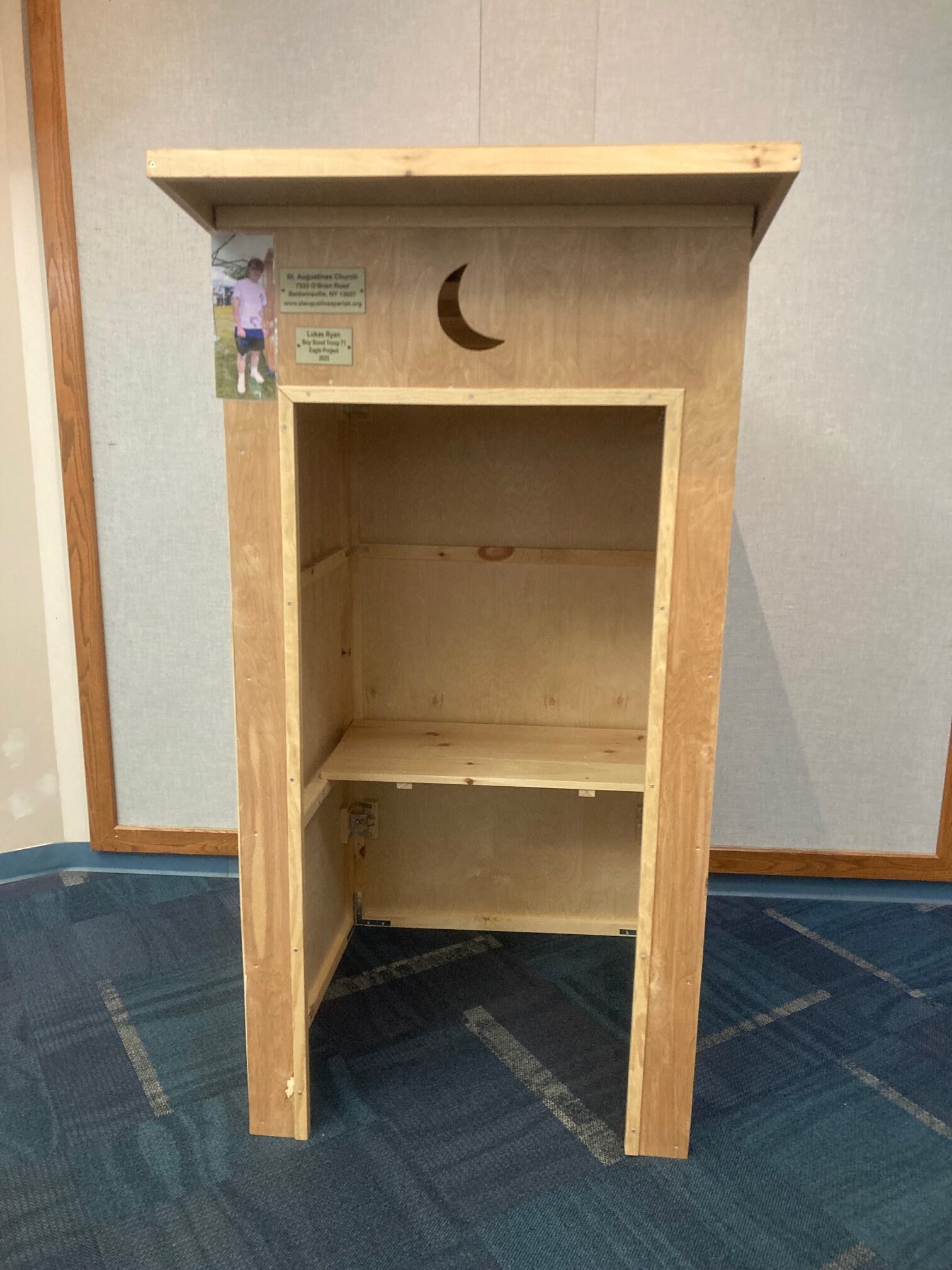 a photo of the empty outhouse waiting for donations